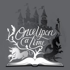 an open book with the words once upon a time on it and two unicorns