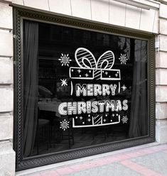 a merry christmas sign in the window of a restaurant