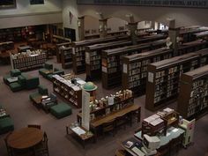 an overhead view of a library with tables and chairs, bookshelves and benches