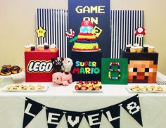 a table topped with cakes and desserts on top of it