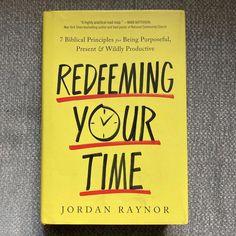 a yellow book with the title redefining your time written in black on it