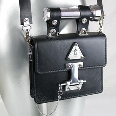 Industrial design Goth Steampunk black leather shoulder bag, evening bag, satchel with torch as a handle.Has removable shoulder strap with shoulder pad, and the torch can be used as the handle.True piece of art and conversation starterBag is vintage, material is genuine leather from ItalyPerforated stainless steel logoTorch as a handleThe torch works.2 x batteries of AAA are required, batteries are not included as the we cannot send these batteries overseasWidth of the bag is 20.50 cm or 8.125 i Goth Industrial, Goth Purse, Unusual Handbags, Goth Steampunk, Industrial Steampunk, Statement Art, Black Leather Crossbody Bag, Evening Handbag, Satchel Purse