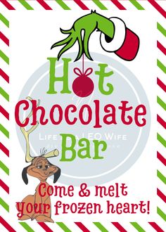 the hot chocolate bar sign is decorated with candy canes and an elf's hat