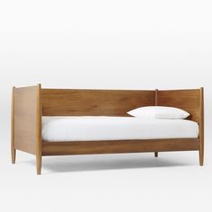 a wooden bed with white sheets and pillows on it's headboard, against a white background