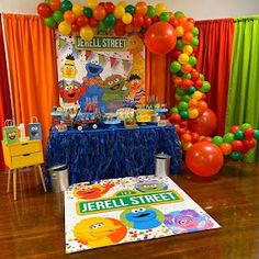 a sesame street birthday party with balloons and decorations