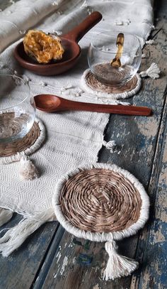 an old wooden table topped with plates and bowls filled with food