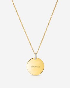 14k solid gold 6 round, natural diamonds: Total carat weight: approximately 0.018 Color: G-H Clarity: SI Pendant dimensions: Length: 15 mm Width: 15 mm Thickness: 1.25 mm Pendant bail dimensions: Height: 6 mm Opening: 3 mm Diamond Cut Cable Chain Length: 16-18 inches, adjustable Width: 0.9 mm Lobster clasp closure   Please specify your engraving request in the Engraving section and refer to the text boxes for each placement's character limit. Important to note: This product includes the pendant and the chain necklace. Pendant is removable from the included chain. All Celine font's letter engraving options are uppercase. Final product may vary slightly from font reference image displayed. Engraved styles are Final Sale. Font Reference, Pendant Bail, Pendant Bails, Round Pendant Necklace, Round Pendant, Lettering Fonts, Diamond Cut, Cable Chain, Necklace Pendant