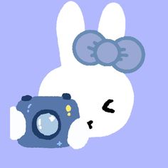 an animal with a camera on its back and the word hello kitty written below it