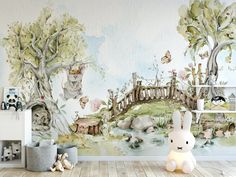 a child's room with a wall mural featuring animals and trees in the background