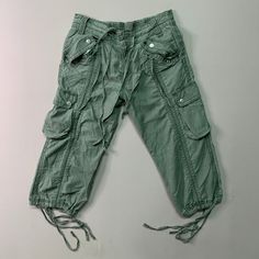 [DESCRIPTION] Please read the description first before buy my items‼️‼️‼️ Vtg Unbranded Utility Multipocket Tactical Cropped Pants All in good condition [MATERIAL] Cutton [MEASUREMENT] Measurement ( WHEN LAID FLAT ): Waist: 29-31 inch (recommended) Insean: 18.5 inch Length: 26 inch Front Rise: 9.5 inch Thigh: 19 inch Opening Leg: 16 inch [CONDITION] - All in good condition  - No hole no stain [PAYMENT & NOTICE] - We accept PayPal ONLY - No return/refund - All items will be post over shipping com Cotton Combat Cargo Shorts, Green Military Parachute Pants With Pockets, Green Combat Style Parachute Pants With Pockets, Green Combat Parachute Pants With Pockets, Green Military Cargo Shorts With Pockets, Military Style Khaki Parachute Pants With Pockets, Green Military Cargo Jeans With Pockets, Military Style Green Cargo Jeans With Hip Pockets, Green Military Cargo Jeans With Hip Pockets