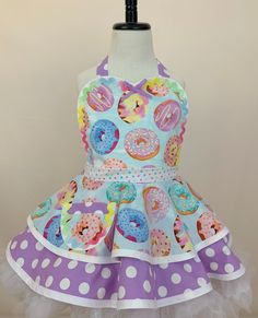 a dress made to look like a mannequin with doughnuts on it