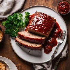 two slices of meatloaf on a plate with sauce