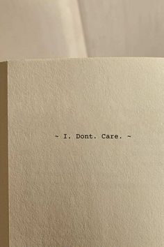 an open book with the words i don't care printed on it