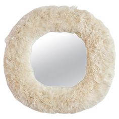 a mirror that is shaped like a furry animal