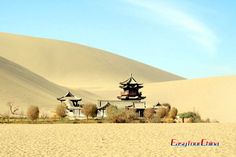 the sand dunes and pagodas are near each other