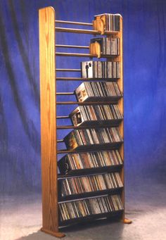 a tall wooden shelf holding several cd's