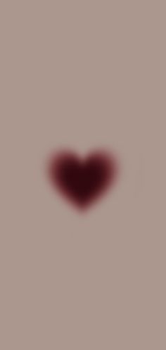 a heart shaped object is shown in the middle of a gray background with red spots