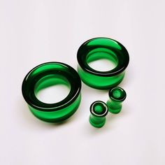 "Green Glass Tunnel Plugs / Gauges for stretched ears. Double flare Tunnels. Sold by the pair. Dark green/black glass plugs are mostly dark green. The smaller pieces will show more light green while the larger plugs will be darker green/black with green showing in bright light. This is from the density of the glass and coloring. These plugs are photographed in bright light. Please keep this in mind when ordering. We have done our best to photograph the widest range of colors and patterns but ple 6mm Gauges Ears, Small Stretched Ears, Pretty Gauges, Glass Tunnel, Piercing Types, Plug Earrings Gauges, Pretty Plugs, Tapers And Plugs, Stretched Lobes