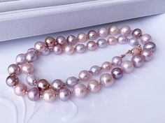 Handmade item: Size: 55 cm Materials: Genuine Round Shape Edison Pearl With Iridescent Color Rare Mauve Pink Golden 13-14 x 11 mm Genuine Freshwater Pearl Size : 9 mm-10 mm Color: pink-lavender Sterling Sliver Frosted Bead Safety Clasp 925 sterling silver rose gold plated NOTE: Gemstones color and inclusions may vary slightly from the picture, due to different monitor setting Formal Pink High Luster Necklace, Lavender Necklace, Iridescent Color, Edison Pearls, Pearls Necklace, Pink Lavender, Freshwater Pearl Necklace, Mauve Pink, Wedding Jewellery Necklace