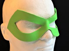 DESCRIPTIONTrick Batman once again as you cosplay Edward "E." Nigma The Riddler! Wear this purple leather mask for your Comicon costume, Cosplay convention, DC fandom event, or Halloween & have fun leaving complex clues, riddles and word games for Gotham City's finest! Get in Purple or Neon Green - Send us a swatch and we can do our best to match your costume! Any color. ** ALSO GREAT FOR MARDI GRAS ** Waterproofed leather, glossy or matte finish, & several choices to affix the mask (cor Superhero Masks And Prosthetics For Halloween Costume Party, Superhero Style Masquerade Masks For Halloween, Superhero Masks For Halloween Masquerade, Themed Eye Mask For Cosplay, Themed Cosplay Eye Mask, Green Fire Sunglasses, Superhero Masks For Cosplay Events, Superhero Mask For Cosplay, Green Lantern Power Battery