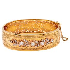 One Belle Époque French Diamond and Pearl 18k Yellow Gold Bangle Bracelet. Featuring four old mine cut diamonds with a total weight of approximately 1.35 carats, graded near-colorless, SI clarity. Accented by 29 seed pearls. Crafted in 18 karat yellow gold with French hallmarks. Circa 1890. The bangle best fits a 6 ½ inch wrist. About this Item: This Belle Époque bangle evokes effortless elegance with its graceful curves and artful design. Handcrafted in France circa 1890, it features 29 seed pe Yellow Gold Bangle, Gold Bangle Bracelet, Gold Bangle, Seed Pearl, Old World Charm, Gold Bangles, Bangle Bracelet, Modern Woman, Timeless Pieces