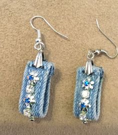 the earrings are made out of jeans and beads