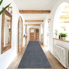 the hallway is clean and ready for us to use as an entrance way in this home