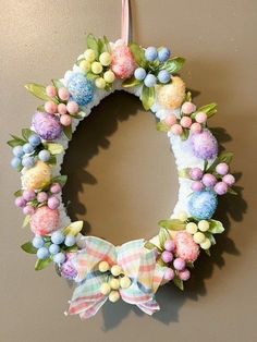 an easter wreath hanging on the wall