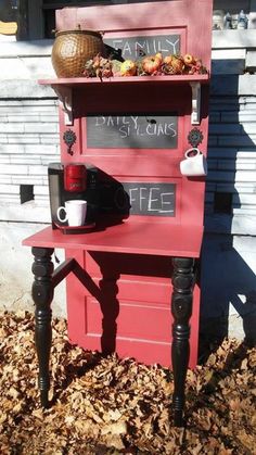 an old red cabinet with writing on it