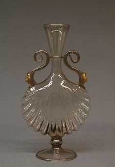 a glass vase with an intricate design on it