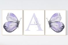 two purple butterflies with the letter a on them, one is painted in watercolor