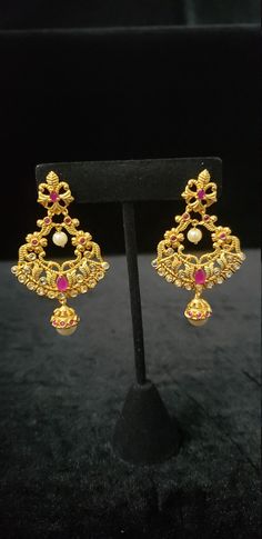 "This Earrings set has an excellent finish and gives out an exquisite sense of style. If you are looking for an amazing Fashion Jewelry set for special occasions such as Anniversary, Engagement, Party, Wedding, or for gifting, then your search ends here. Handmade Indian Temple Jewelry, best to wear it for traditional ceremonies or Indian wedding. This bridal jewelry has an ethnic finish. It has Cubic Zircon stones with semi-precious ruby and emeralds. It is a Bollywood style one gram jewelry. Th Elegant Festive Hoop Earrings With Latkans, Elegant Festive Plug Earrings, Elegant Hoop Earrings With Latkans For Festivals, Elegant Hoop Earrings For Diwali Party, Formal Chandbalis With Latkans, Elegant Hoop Earrings For Diwali Celebration, Elegant Jeweled Earrings For Diwali, Temple Jewelry Bridal Earrings For Party, Party Temple Jewelry Pearl Drop Earrings