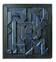 an art piece made out of black and blue paper with geometric shapes on it,