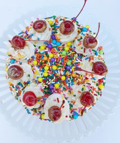 a cake with sprinkles, jelly beans and candy toppings on it