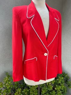 "Vintage preppy bright red blazer jacket with white piping trim Sz 4 by Saks Fifth Avenue. Made in USA fabric is Fibranne ( linen fabric) and fully lined. Pockets. Very good condition Measurements Shoulders with pads 16\" Sleeves 22\" Bust 36\" Waist 32\" Hips 36\" Length 25\"" Classic Tailored Blazer With Contrast Trim, Classic Fitted Blazer With Contrast Trim, Spring Workwear Blazer With Contrast Trim, Fitted Blazer With Contrast Trim For Office, Classic Spring Outerwear With Contrast Trim, Fitted Spring Outerwear With Contrast Trim, Classic Red Blazer For Spring, Red Blazer Jacket, Preppy Vintage