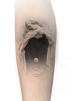 a woman's arm with an image of the sun and planets on it, in black and white