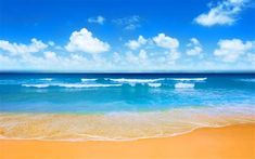 there are waves coming in to the beach and blue sky with white clouds above it