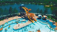 an aerial view of a water park with a large slide