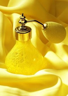 a soap dispenser sitting on top of a yellow cloth