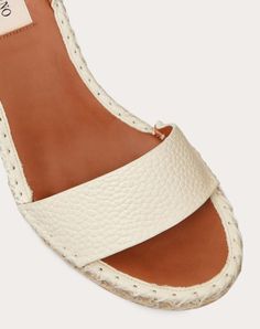 Valentino Garavani Double Rockstud wedge in elk-print calfskin leather. - Platinum-finish studs - Tonal calfskin ankle strap - Rope and rubber sole - Heel height 105 mm / 3.7 in. with 15 mm/0,6 in. platform - Made in Italy White Leather Wedge Sandals With Flat Heel, Cream Leather Wedge Sandals For Beach, Beige Leather Wedge Sandals With Textured Sole, White Sandals With Leather Lining For Summer, White Leather-lined Sandals For Summer, Cream Leather Sandals With Woven Sole, Cream Leather Round Toe Wedge Sandals, Cream Leather Wedge Sandals With Round Toe, Natural Leather Wedge Sandals With Woven Sole