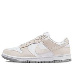 Looking for a versatile, sustainable sneaker to take your style up a notch? Check out the Nike Dunk Low Next Nature in white cream! Made with at least 20% recycled content, this low-top sneaker is perfect for those who want to minimize their environmental impact without sacrificing style. The synthetic leather upper features a pristine white base with soft beige overlays and a color-matched Swoosh, while the Volt-colored sockliner adds a pop of color. Standard Nike branding appears on the tongue tag and heel tab, while the grey rubber outsole provides durability and traction. (SNKR/Skate/Low Top/Women's/Non-Slip/Recyclable Materials) Nike Dunk Low Next Nature, Elegant Sneakers, Adidas Spezial, Nike Brand, Cute Nikes, Nike Sb Dunks, Nike Air Max Plus, Jordan 5, Newest Jordans