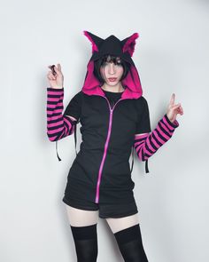 "𝘾𝘼𝙏 𝙀𝘼𝙍𝙎 𝙃𝙊𝙊𝘿𝙄𝙀 - 𝙋𝙄𝙉𝙆 - 𝙈𝘼𝙇𝙀 / 𝙁𝙀𝙈𝘼𝙇𝙀 𝘾𝙐𝙏 Black cat hoodie with ears. This cat ear hoodie has pink fur inside the standing cat ears. 𝗪𝗛𝗔𝗧 𝗪𝗜𝗟𝗟 𝗜 𝗥𝗘𝗖𝗘𝗜𝗩𝗘？ ♥ Zip up hoodie ♥ Hood with cat ears (fur inside) ♥ Detachable sleeves (easy to apply!) ♥ Sleeves with thumbholes ♥ Big pockets to hold your stuff :D 𝗙𝗔𝗕𝗥𝗜𝗖: Cotton sweatshirt, faux fur for the ears 𝗦𝗜𝗭𝗘: Male or female cut. Size chart you will find it on the last photo! For custom size Cat Ears Hoodie, Harajuku Style Hooded Pink Top, Harajuku Style Pink Hooded Top, Pink Harajuku Cotton Hoodie, Pink Harajuku Style Cotton Hoodie, Pink Cotton Harajuku Style Hoodie, Pink Harajuku Hooded Sweatshirt, Pink Harajuku Style Hooded Sweatshirt, Pink Harajuku Hoodie With Drawstring