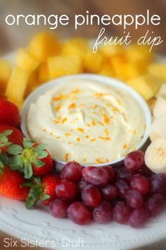 a plate topped with fruit and dip surrounded by sliced bananas