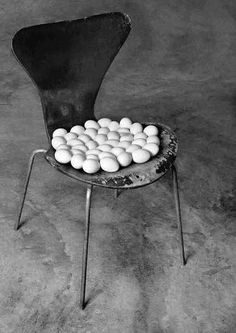 a chair with eggs in it sitting on the floor