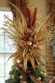 Christmas tree decorated with gold and red ornaments and glittery branches. Feather Tree Toppers Christmas, Making A Tree Topper, Ribbon Tree Topper Ideas, Pinecone Tree Topper, Red Tree Topper, Christmas Tree Topper Ideas 2024, Tree Topper Ideas Christmas, Xmas Tree Topper Ideas, Diy Tree Toppers Christmas