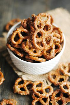 a bowl filled with pretzels on top of a table