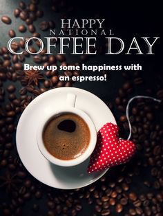 a cup of coffee sitting on top of a white saucer next to some coffee beans