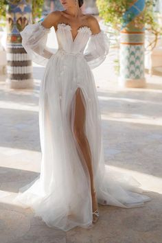 Style: K1301 Closure: Lace-Up Details: V-Neck, Strapless, Long Sleeves, Sheer, Tulle, A-Line, Long, Sweep Train Fabric: Tulle Neckline: V-Neck Silhouette: A-Line Train Fabric, Long Gown For Wedding, Bohemian Beach Wedding, Tulle Neckline, Boho Bridal Gowns, Wedding Dress Store, Wedding Dress Chiffon, Applique Wedding Dress, Bridal Party Dresses