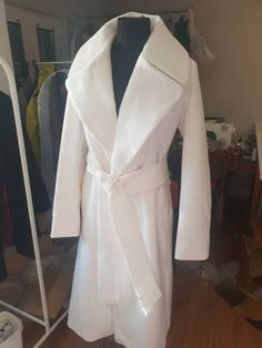 "Beautiful white coat. Stylish and elegant, with a gorgeous big collar. The length is mid-calf. The fabric is soft and gentle, very high quality blend of wool, cotton and polyester. It has everything to underline your feminine curves - oversized cowl, high-waisted belt and elongated silhoutte. It will look great with leggings and high boots, as well as with a maxi dress and high heels. The color is not white white, it is more like white/ivory. Please be aware that I need 4-5 days for processing. Long Winter Wedding Outerwear, Winter Wool Dress, Wool Dress Coat, White Coats, White Winter Coat, Formal Coat, Princess Coat, Elegant Coats, Classic Coat