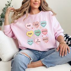 Thank you for checking out my Ew Valentine's Day sweatshirt with candy hearts. These shirts are so soft and comfy. Choose between pink, sport grey, sand, or white. These are unisex fit, so double check the size guide before ordering. This sarcastic Valentine's shirt is perfect for anti Valentine's people or anyone that is so over Valentine's Day. If you like this listing, please visit my shop. I'm a full time band teacher that sells laser items, apparel, ornaments, and unique gifts. teamfreitas.etsy.com/shop Ew Valentine Sweatshirt Women Anti Valentine Shirt Candy Hearts Sweatshirt Single Valentine Shirt Sarcastic Valentine Funny Valentine Shirt Valentine Funny, Band Teacher, Valentines For Singles, Valentine Sweatshirt, Candy Hearts, Heart Sweatshirt, Valentine Shirt, Sweatshirt Women, Heart Candy